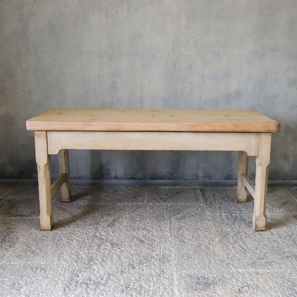 A 19th-century English country house prep table featuring a thick natural timber top, an off-white painted wooden base, a side drawer, and low stretchers. View IV