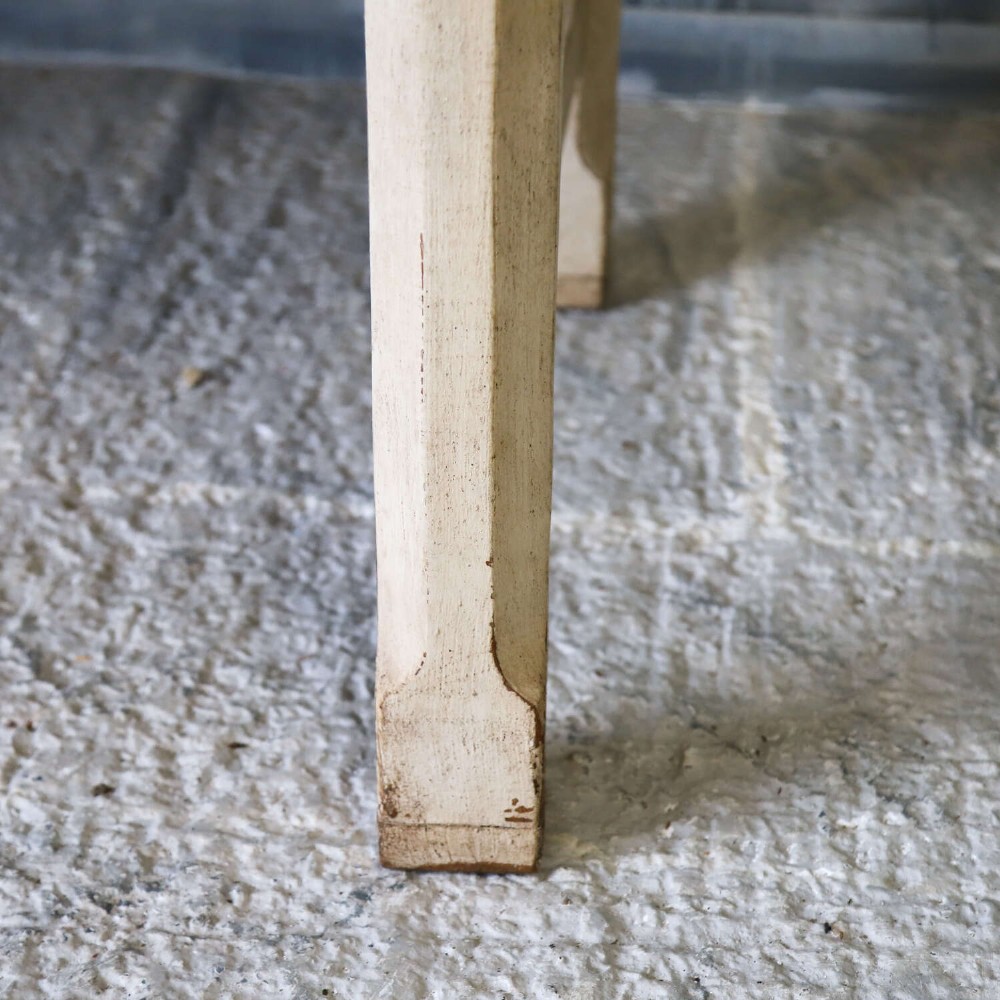 A 19th-century English country house prep table featuring a thick natural timber top, an off-white painted wooden base, a side drawer, and low stretchers. View VI