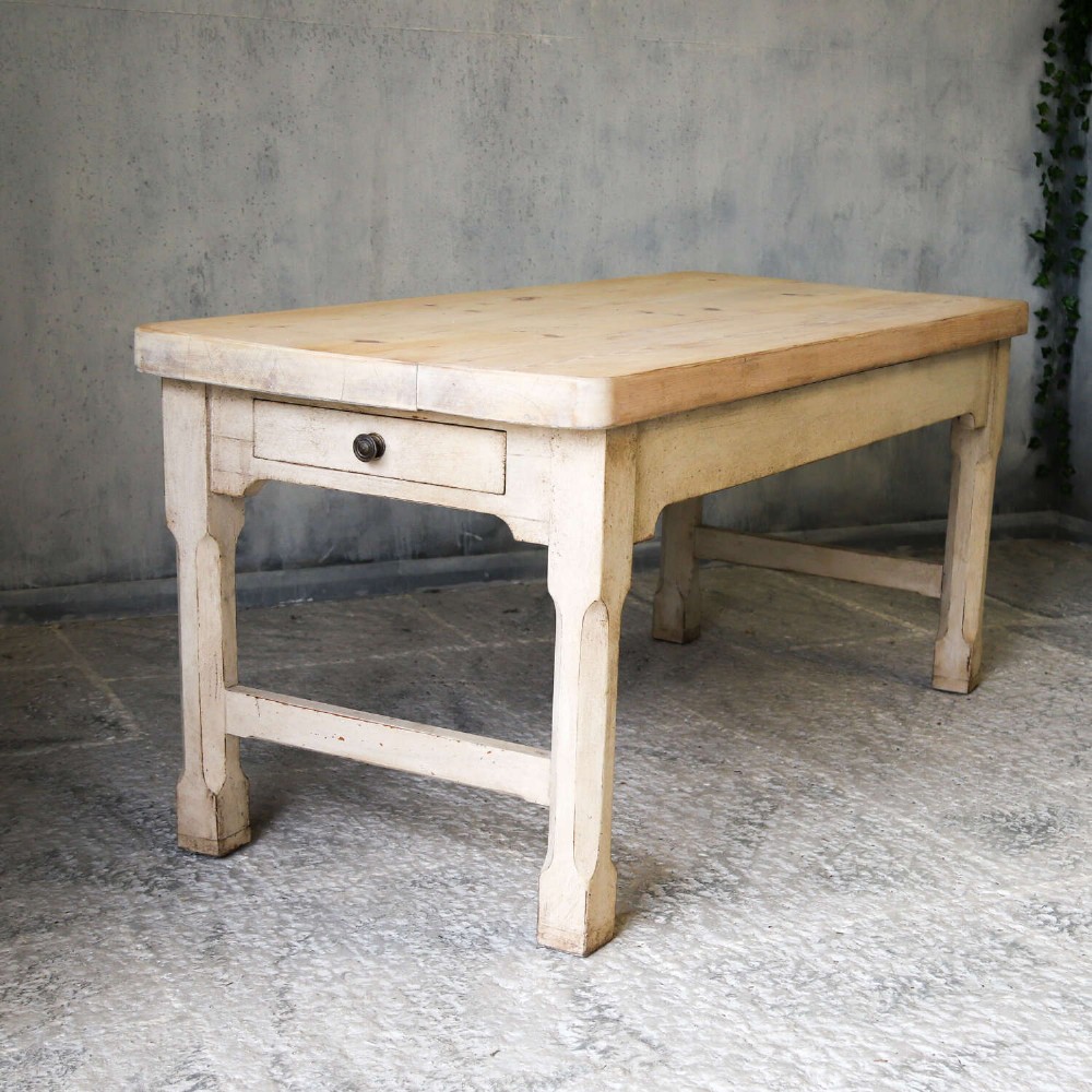 A 19th-century English country house prep table featuring a thick natural timber top, an off-white painted wooden base, a side drawer, and low stretchers. View IX