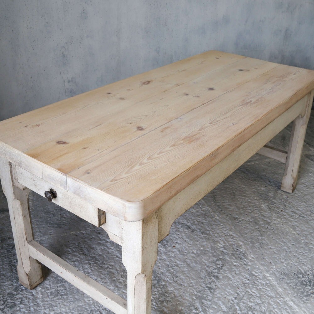 A 19th-century English country house prep table featuring a thick natural timber top, an off-white painted wooden base, a side drawer, and low stretchers. View XI