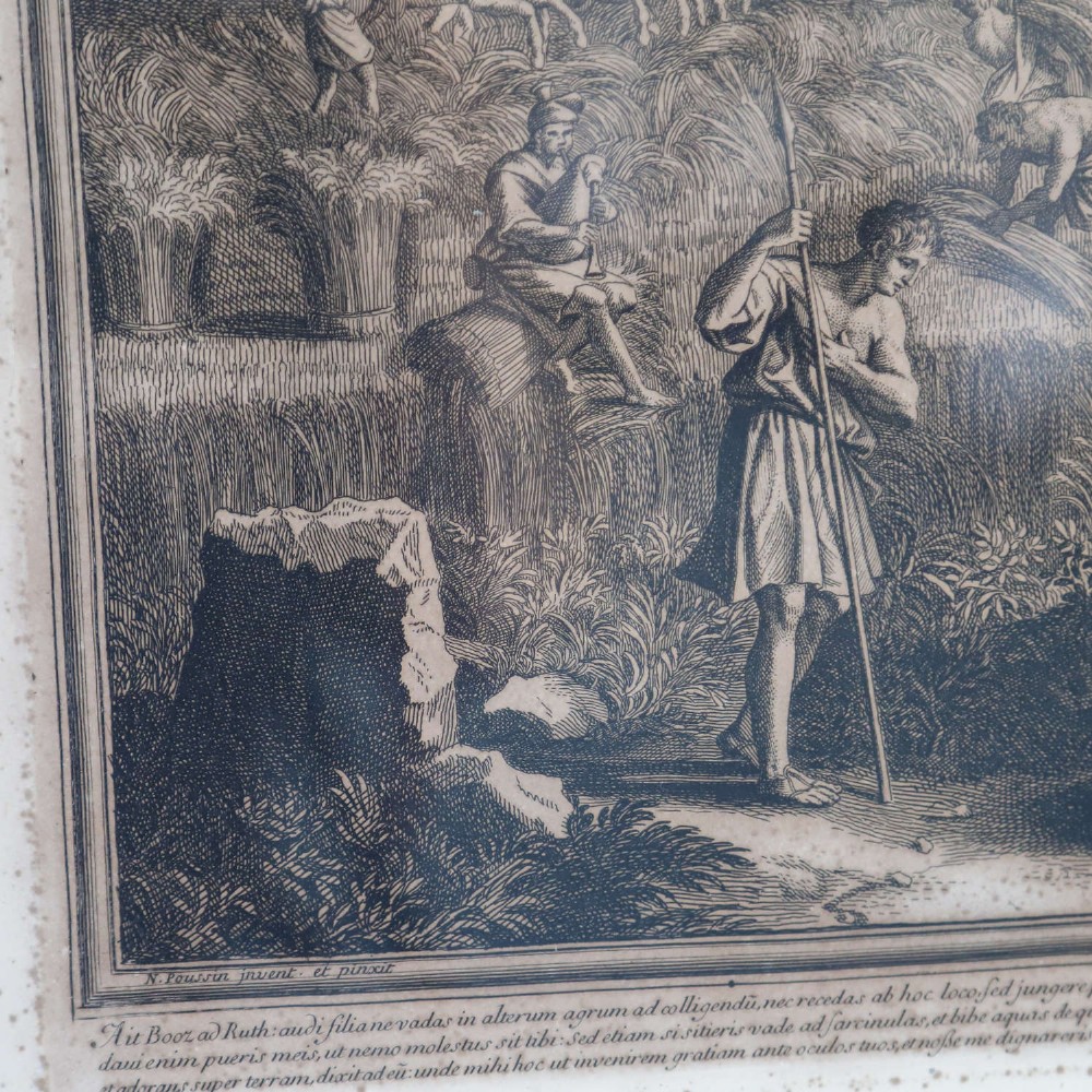 A framed monochrome engraving depicting a classical harvest landscape scene with figures working in a field beneath trees, enclosed in a dark wood frame. View V