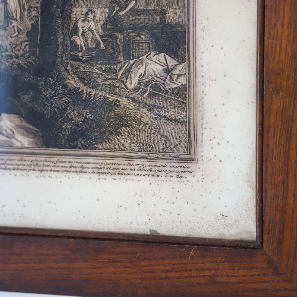 A framed monochrome engraving depicting a classical harvest landscape scene with figures working in a field beneath trees, enclosed in a dark wood frame. View VII