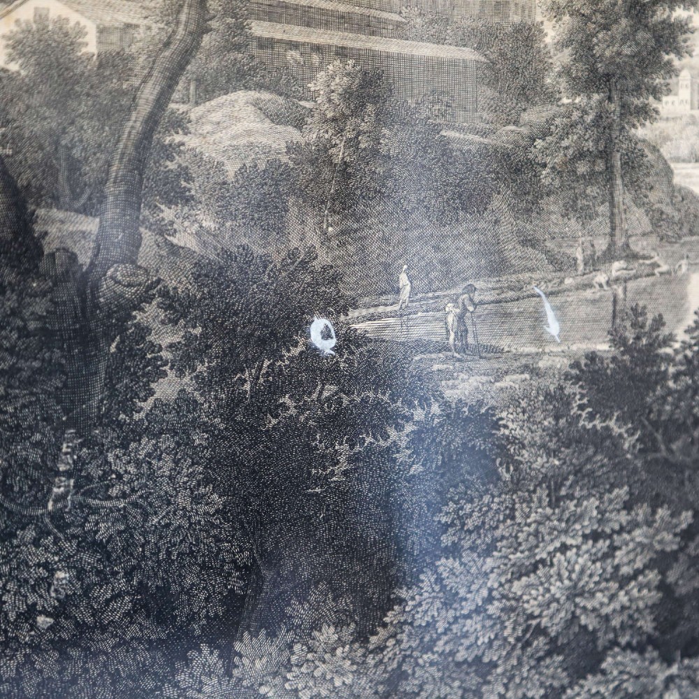 An 18th-century monochrome French engraving depicting a classical landscape with figures beside a body of water, housed in a plain dark wood frame. View VI