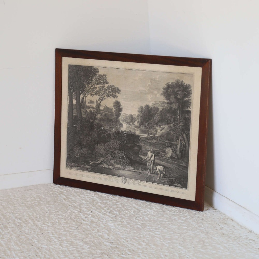 An 18th-century monochrome French engraving depicting a classical landscape with figures beside a body of water, housed in a plain dark wood frame. View XIII