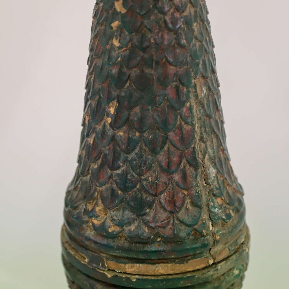 A pair of carved wooden torcheres featuring fish-scale carved baluster columns, square top platforms with beaded borders, scrolled feet, and distressed original green paint. View VII