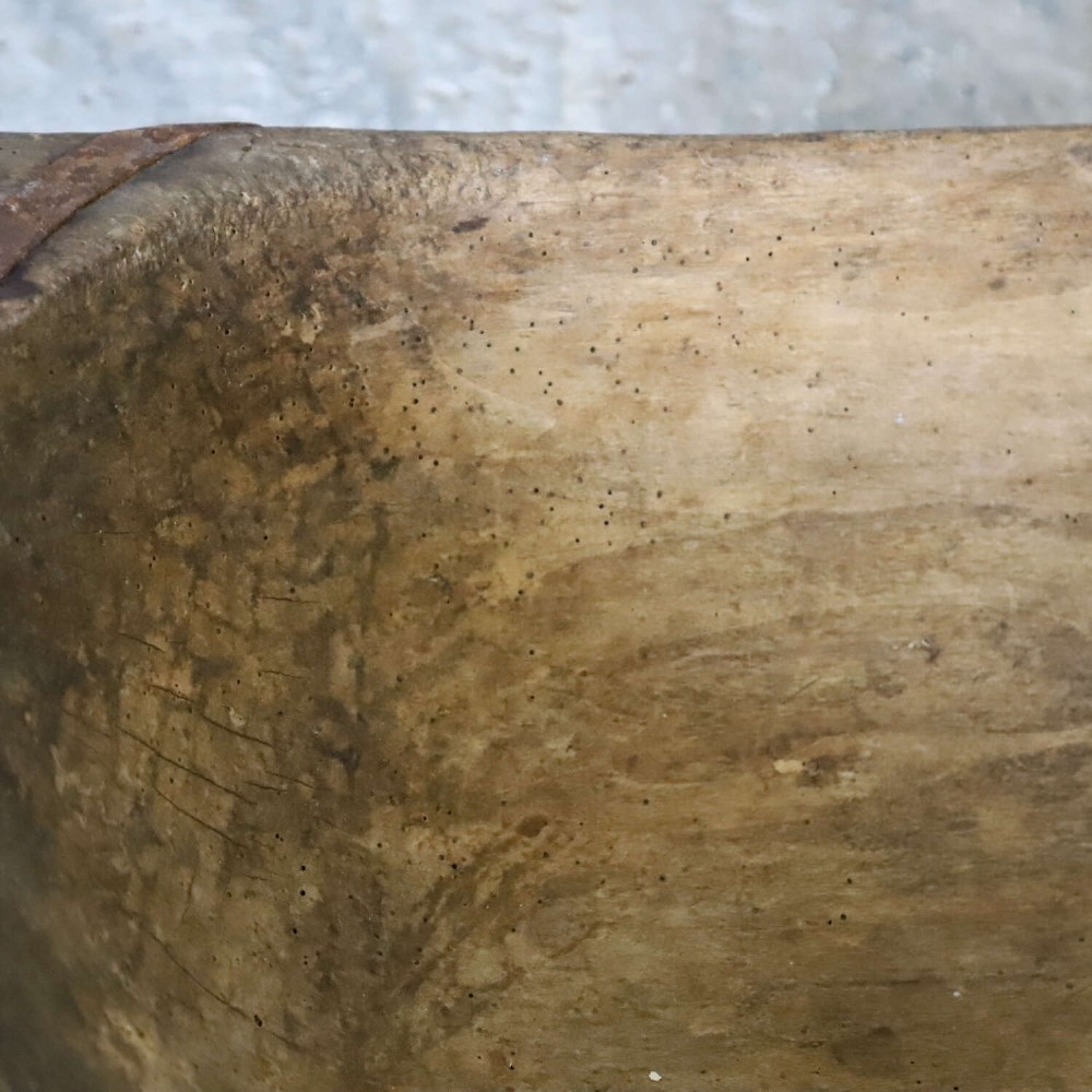 A hand-carved 19th-century French wooden dough trough with integrated handles and a weathered surface. View VIII