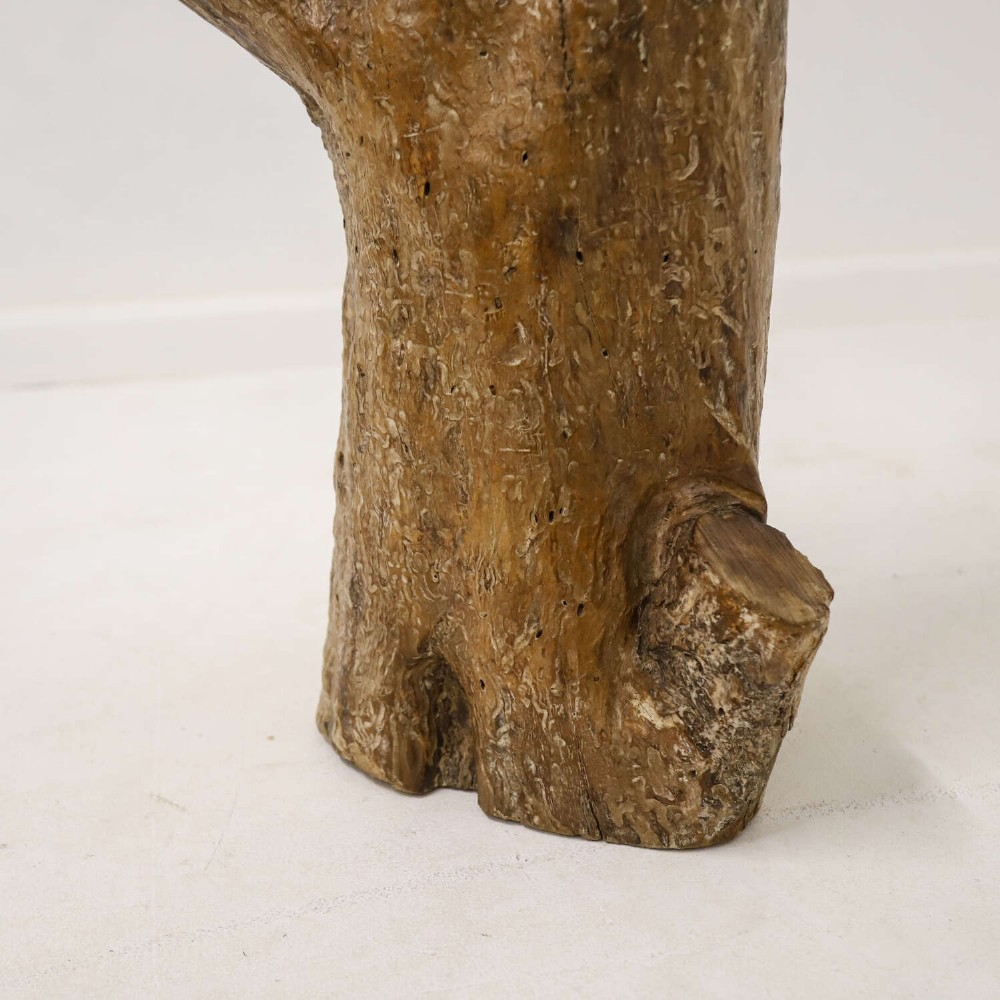 A nineteenth-century T-shaped wrought iron farriers anvil mounted into a natural carved fruitwood log trunk. View V