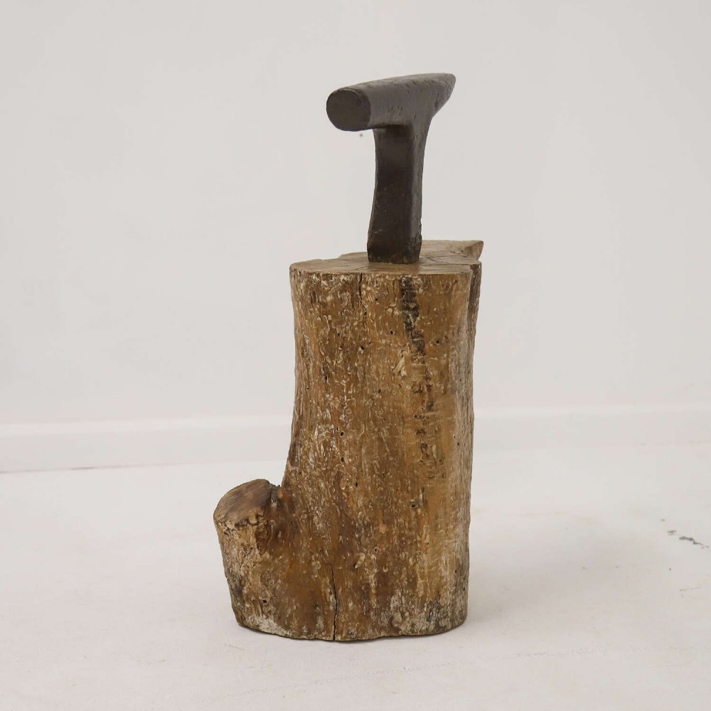 A nineteenth-century T-shaped wrought iron farriers anvil mounted into a natural carved fruitwood log trunk. View VII