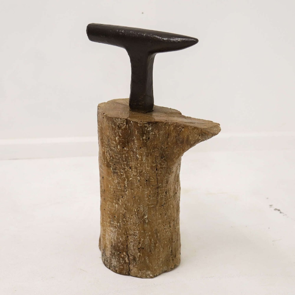A nineteenth-century T-shaped wrought iron farriers anvil mounted into a natural carved fruitwood log trunk. View VIII