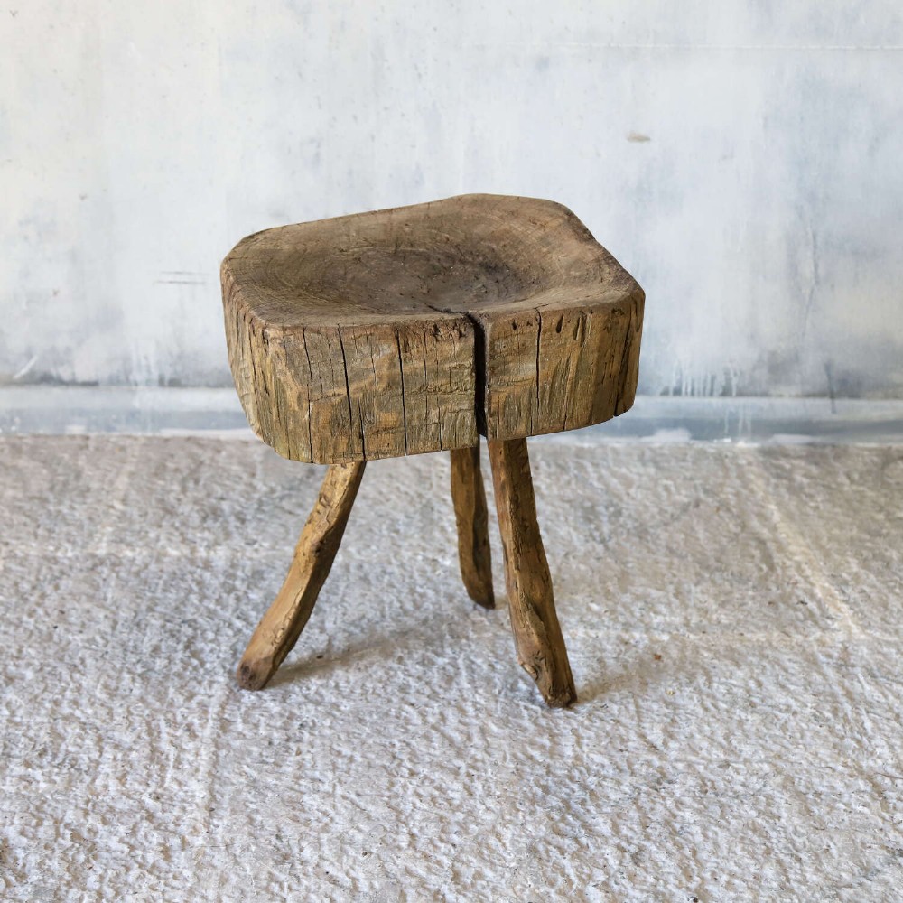 A 19th-century French elm chopping block featuring a heavy carved wooden top supported by three natural gnarled legs. View XIII