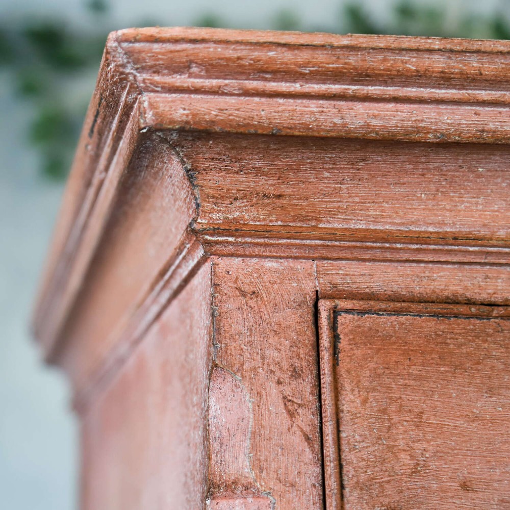 An eighteenth-century Georgian chest on chest with a distressed terracotta painted finish, brass pierced handles, and bracket feet. View VI