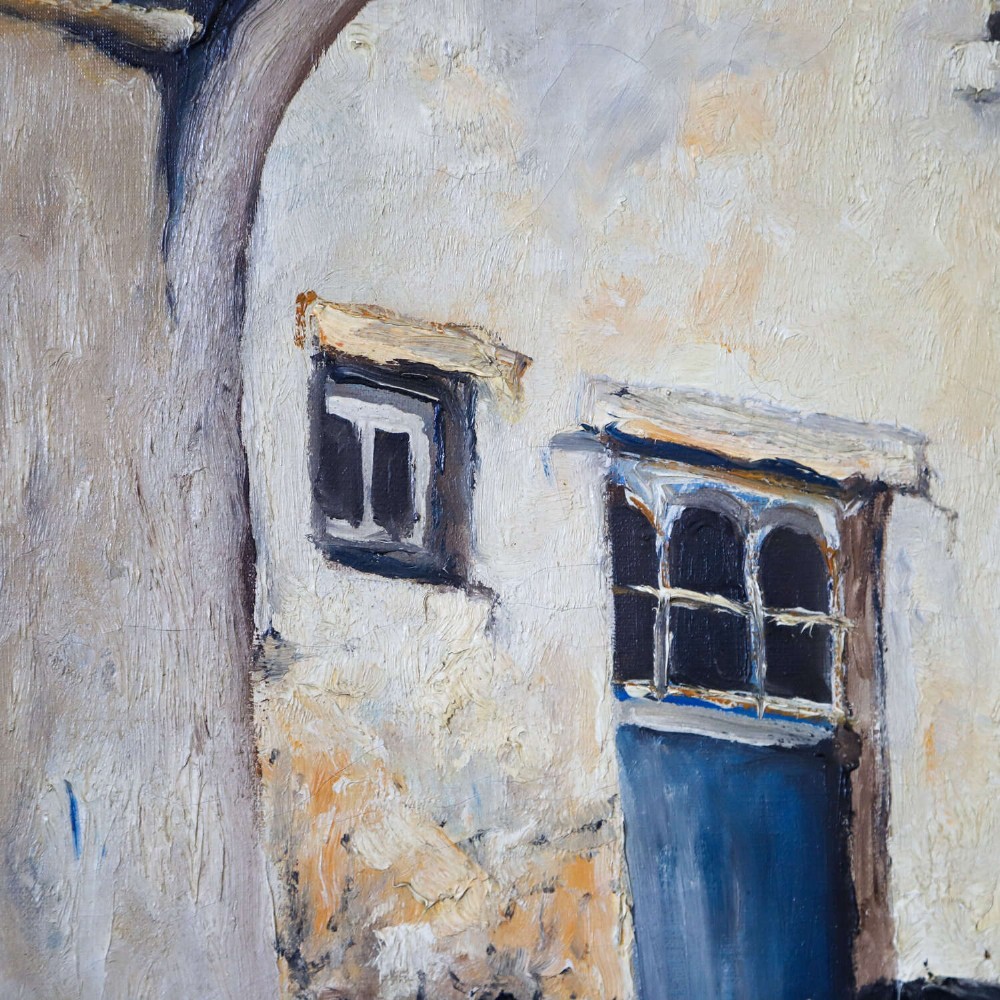 An oil painting on canvas depicting a Flemish cobbled street framed by a dark archway, featuring white plaster buildings and a blue door, signed by L. De Gent. View III