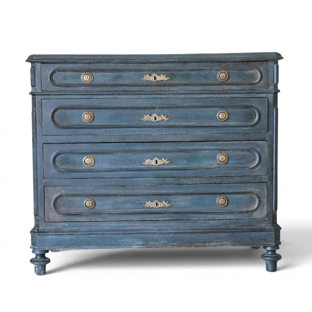 A late 19th-century French Louis XVI Revival chest of drawers painted in slate blue with four drawers featuring decorative brass hardware.