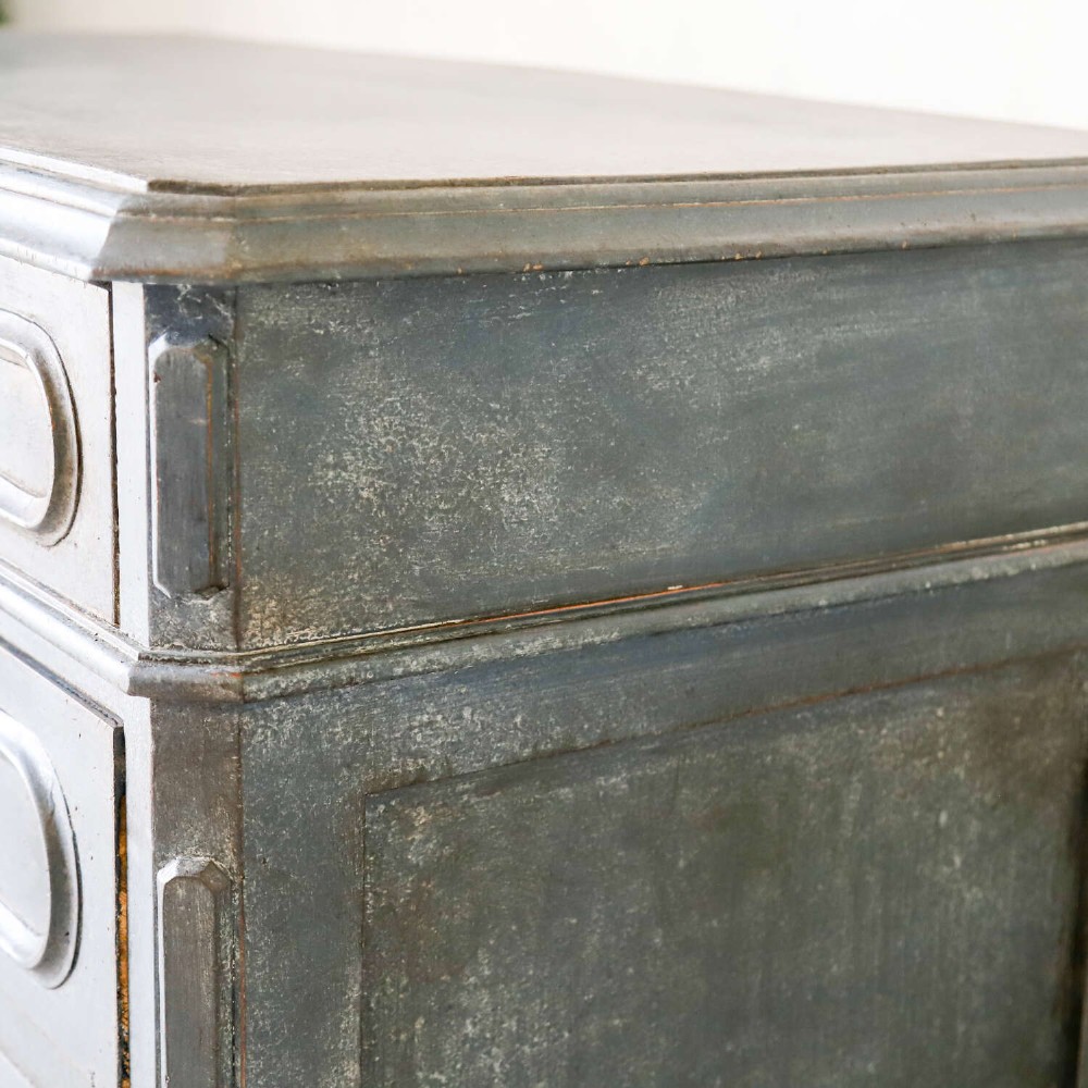 A late 19th-century French Louis XVI Revival chest of drawers painted in slate blue with four drawers featuring decorative brass hardware. View XI