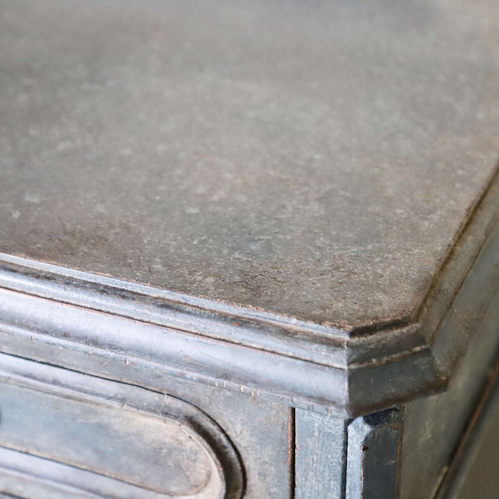 A late 19th-century French Louis XVI Revival chest of drawers painted in slate blue with four drawers featuring decorative brass hardware. View XII