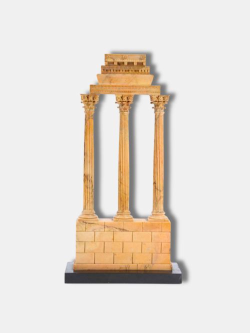fig 1. A yellow Giallo Antico marble model depicting three fluted Corinthian columns and entablature from the Temple of Castor and Pollux set on a black marble base.
