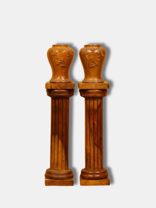 fig 1. A pair of turned and fluted warm brown hardwood Neoclassical column pedestals with square base plinths and capital tops.