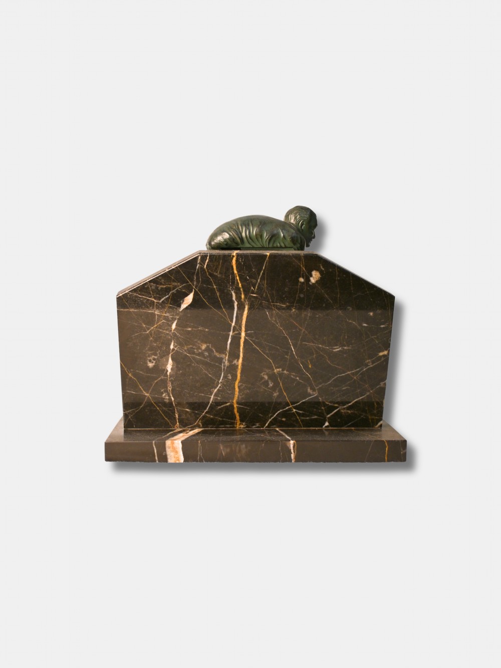 An Art Deco green patinated spelter relief sculpture depicting a cyclist leaning over handlebars, mounted on a veined black onyx plinth. View III