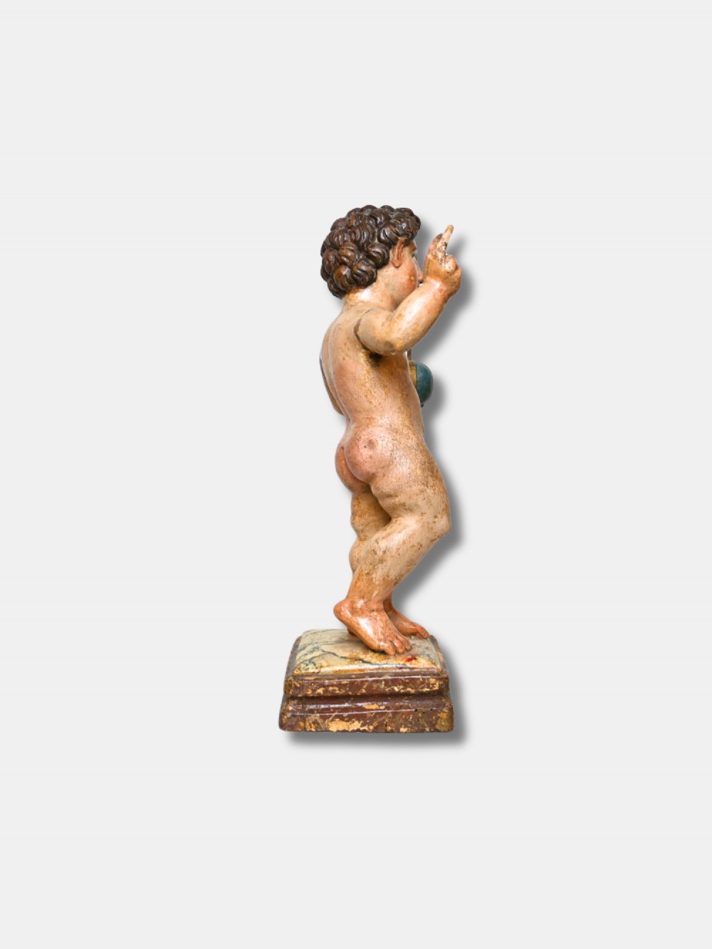 A 17th-century Spanish carved polychrome wood sculpture depicting the standing Infant Jesus holding a blue and gold orb in his left hand and raising his right hand in blessing. View II