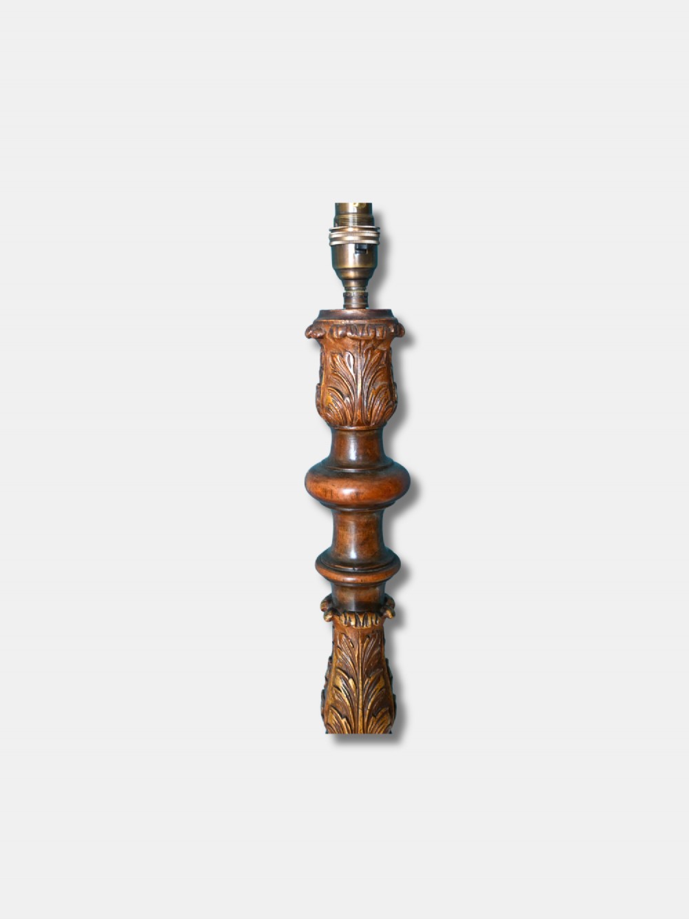 A c. 1920 English turned walnut standard lamp featuring carved parcel-gilt accents and a tripod base with shaped feet. View II