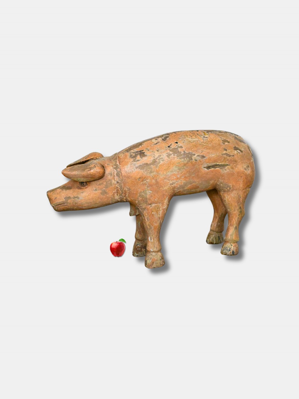 A carved wooden butcher shop trade sign shaped like a pig with a distressed ochre painted finish and white hand-lettered typography. View III