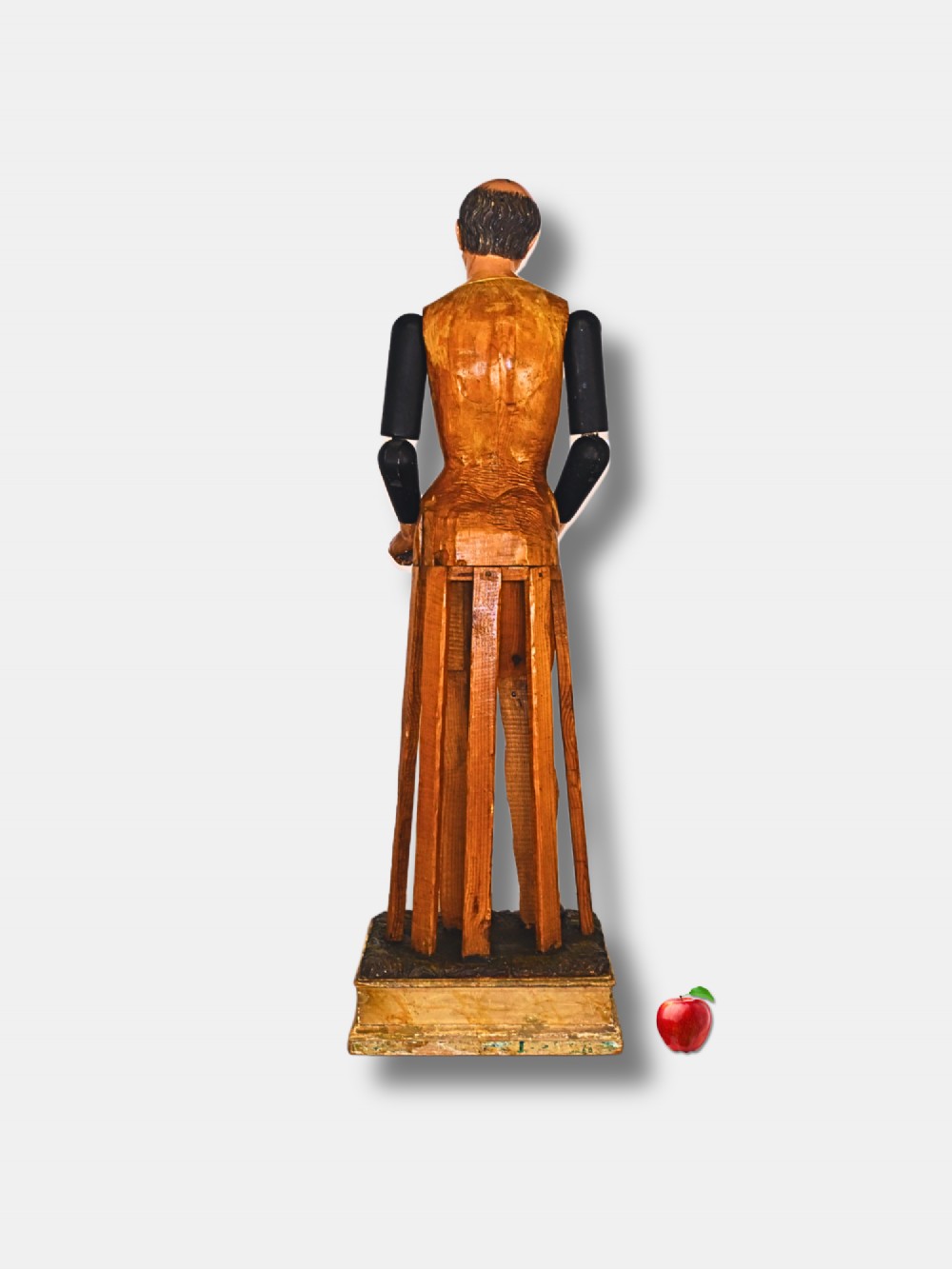 A life-sized 19th-century carved wooden Italian Santos figure with dark articulated arms, polychrome facial features, and a stepped timber base. View III