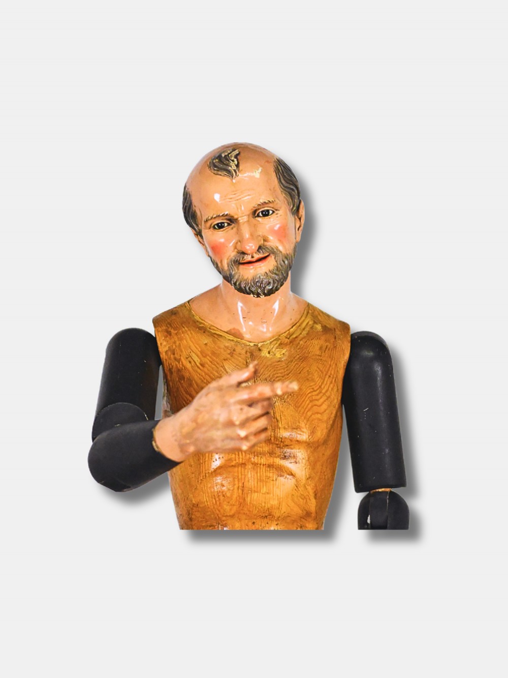 A life-sized 19th-century carved wooden Italian Santos figure with dark articulated arms, polychrome facial features, and a stepped timber base. View IV