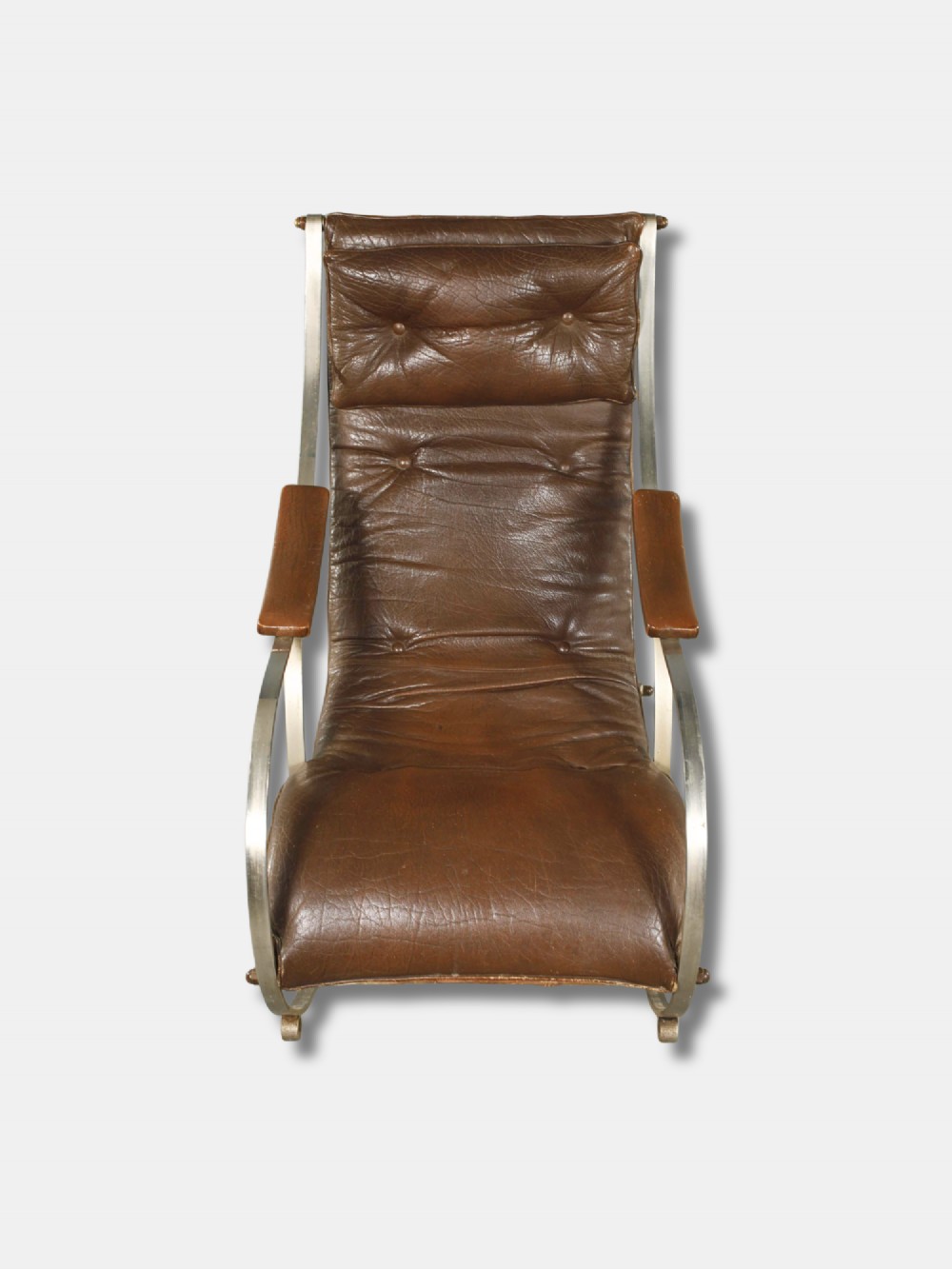 A Victorian metal rocking chair with a curved strap steel frame, brown button-tufted leather upholstery, padded armrests, and an integrated headrest cushion. View III