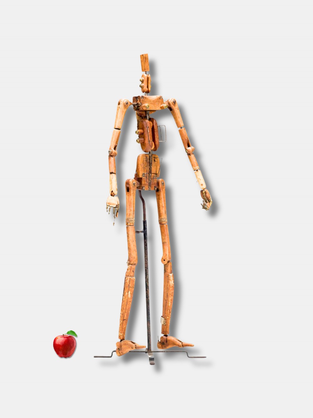 A life-size 18th-century French articulated wooden lay figure with exposed jointed limbs mounted on a dark metal stand. View II