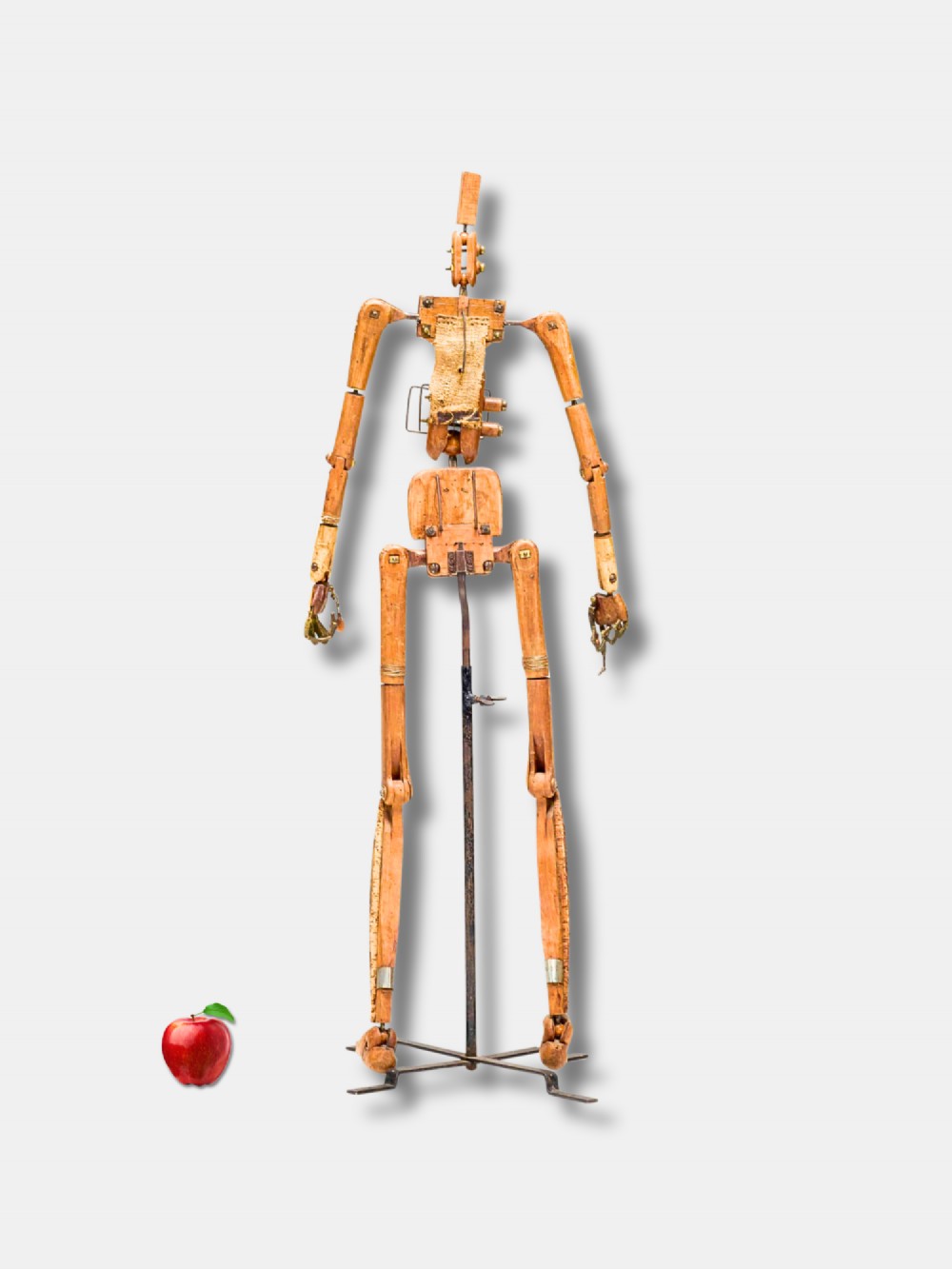 A life-size 18th-century French articulated wooden lay figure with exposed jointed limbs mounted on a dark metal stand. View III