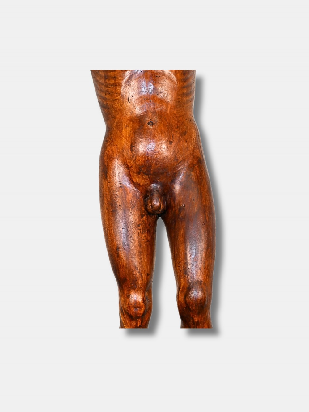An 18th-century carved wood male figure standing on a square stepped wooden plinth. View IV
