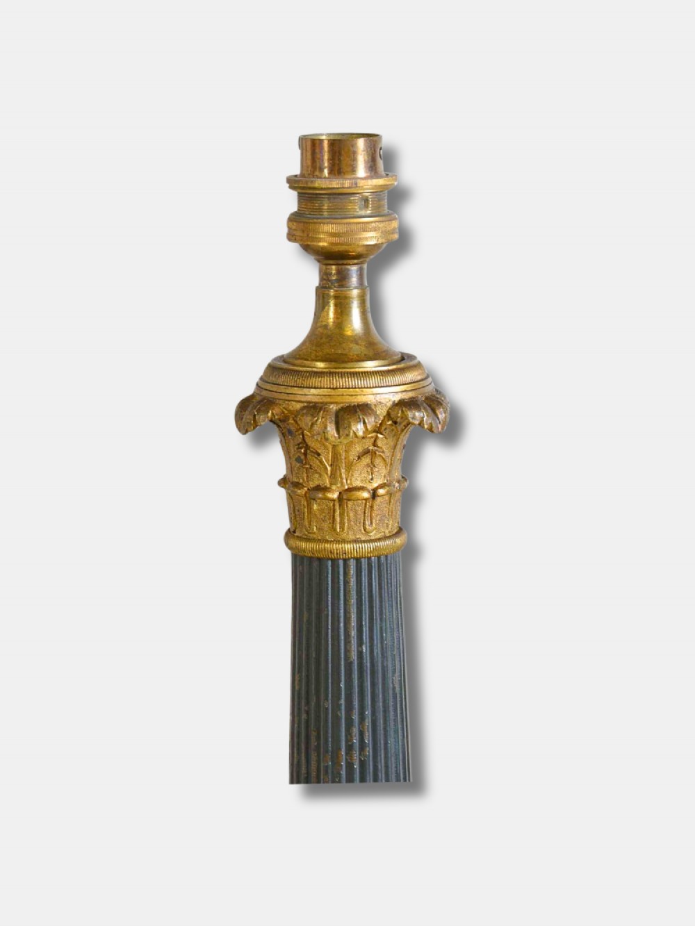 A pair of French Empire table lamps featuring dark fluted column shafts, gilded leaf capitals, lion paw feet, and triangular bases. View IV