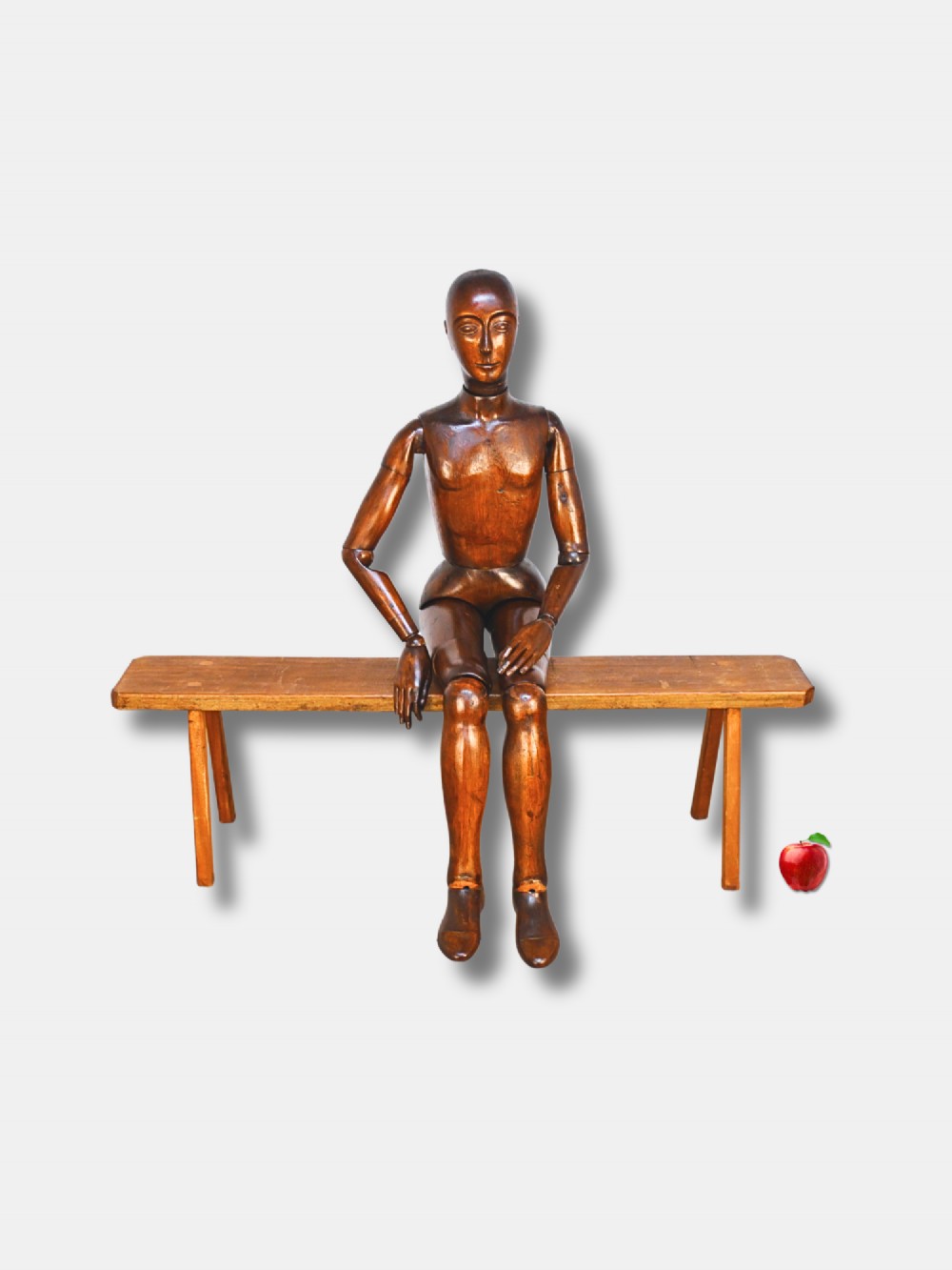 A nineteenth-century French life-size wooden articulated lay figure with hand-carved facial features and fully jointed limbs.