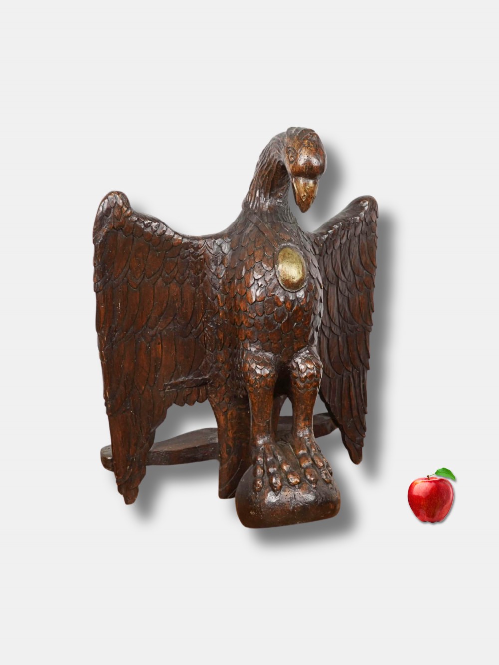 An eighteenth-century carved oak lectern depicting an eagle with outstretched wings and a small gilded oval medallion on its chest. View II