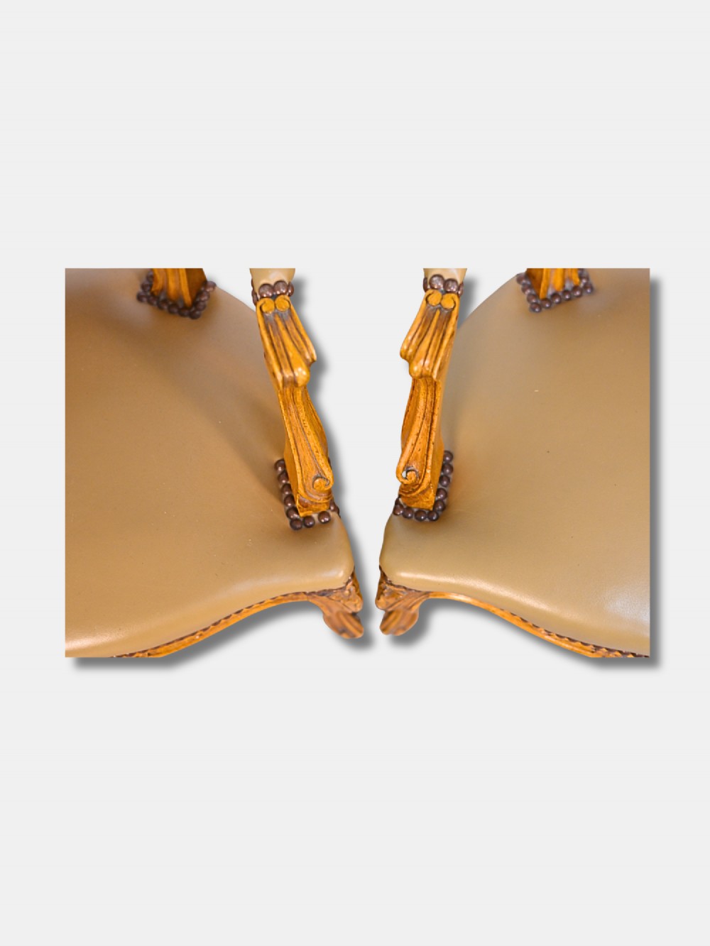 A pair of 19th-century French child-sized walnut armchairs featuring carved frames, woven cane backrests, cabriole legs, and olive green leather seats. View IV