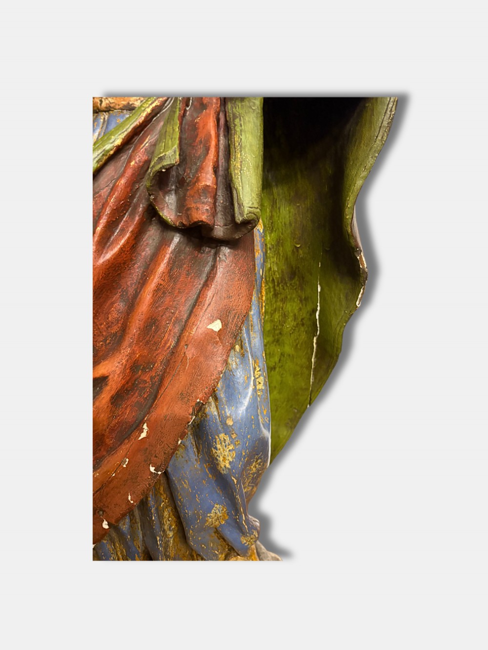 An 18th-century Peruvian carved polychrome wood statue of Saint Joseph holding the infant Jesus standing on a base decorated with cherub heads. View VII