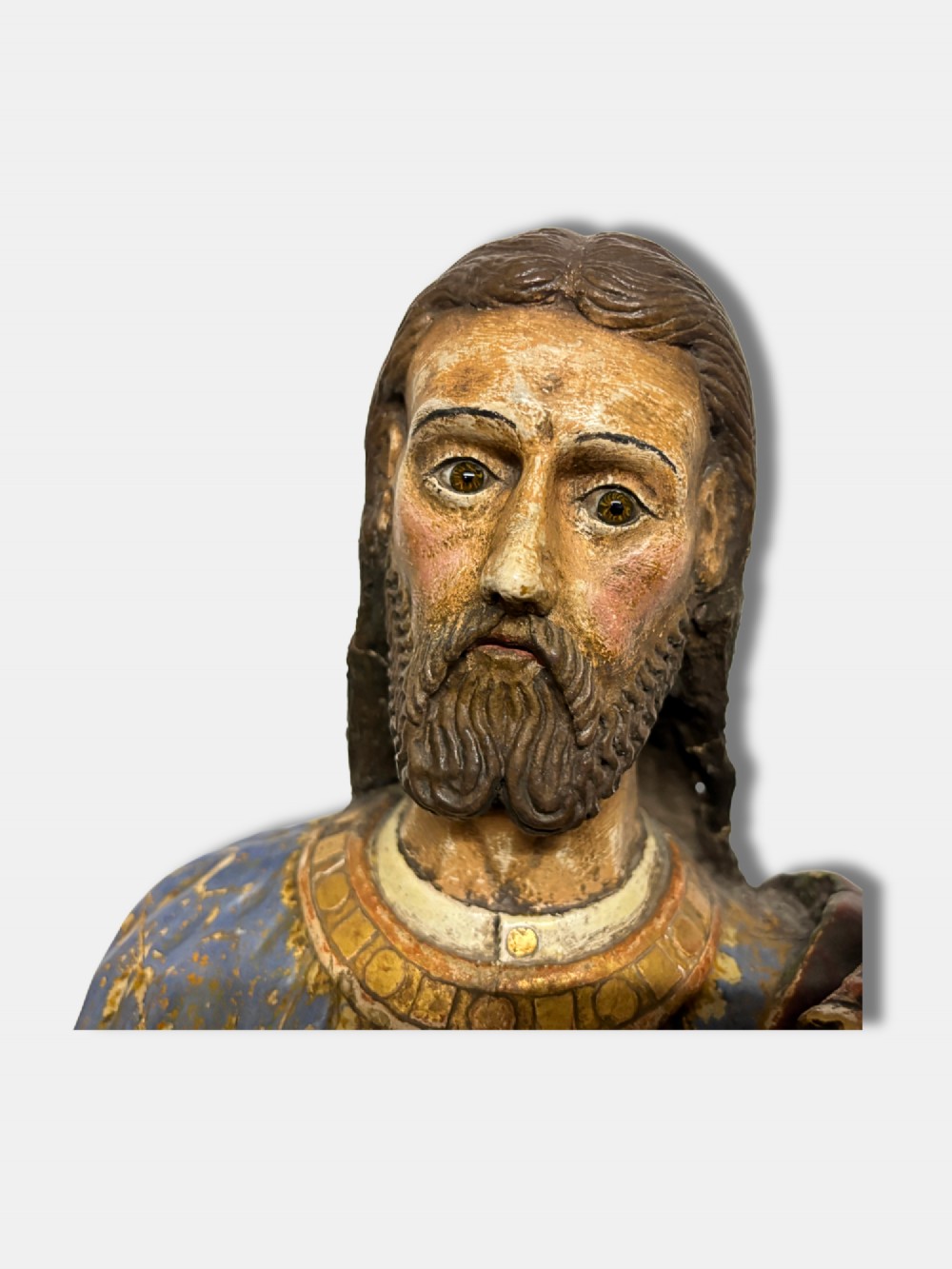 An 18th-century Peruvian carved polychrome wood statue of Saint Joseph holding the infant Jesus standing on a base decorated with cherub heads. View VIII