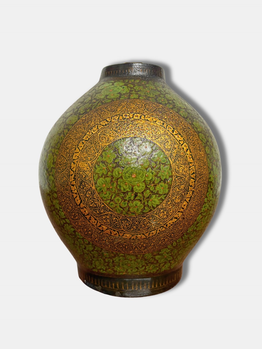 A rounded Kashmiri table lamp painted with intricate green and gilt floral patterns, topped with a brass light fitting and an exposed filament bulb. View III