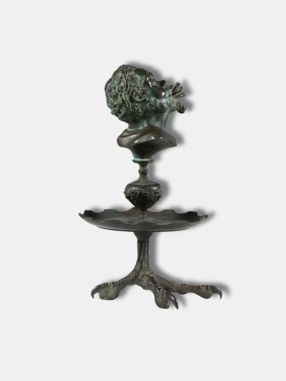 An antique circa 1820 Italian patinated bronze oil lamp featuring a tripod eagle claw base, a central circular tray, and a top finial shaped as a bust of a satyr. View II