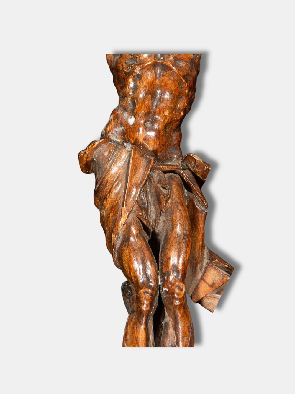 An 18th-century Spanish carved wooden crucifix depicting Jesus Christ on a rustic timber cross. View III