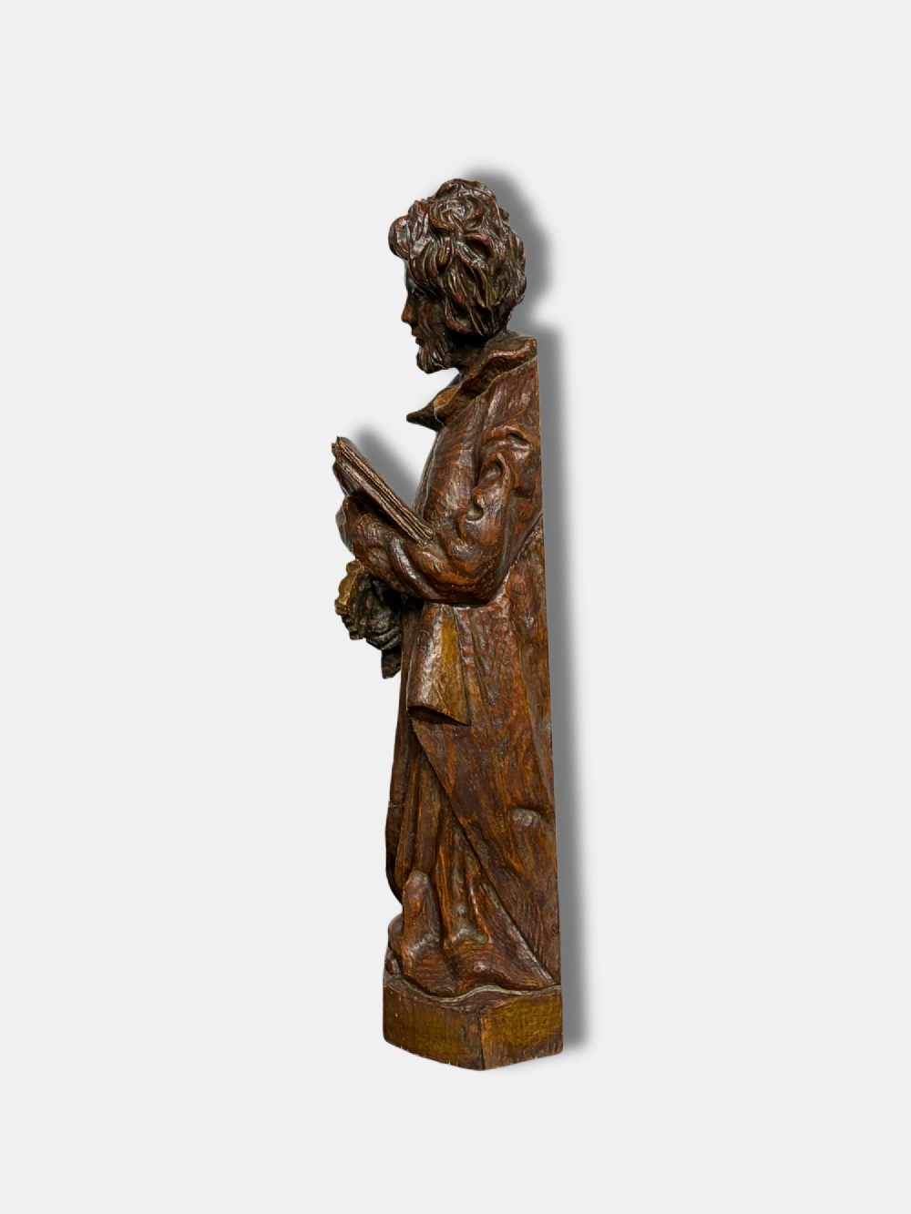 An 18th-century French carved wood statue depicting Saint Peter holding a book and keys. View II