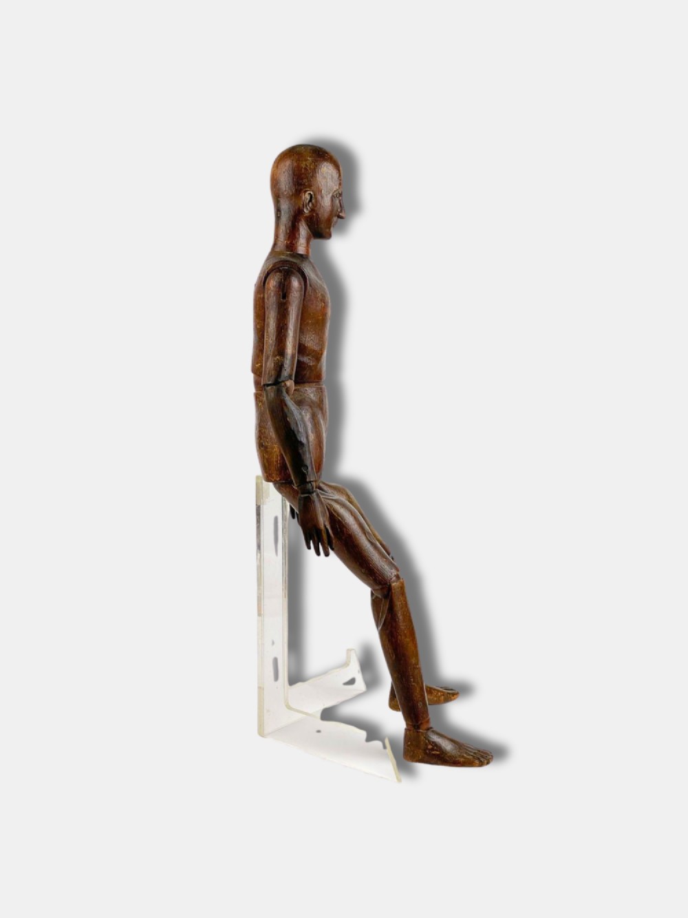 A French carved wooden articulated artist lay figure with a warm brown finish and posable limbs. View II