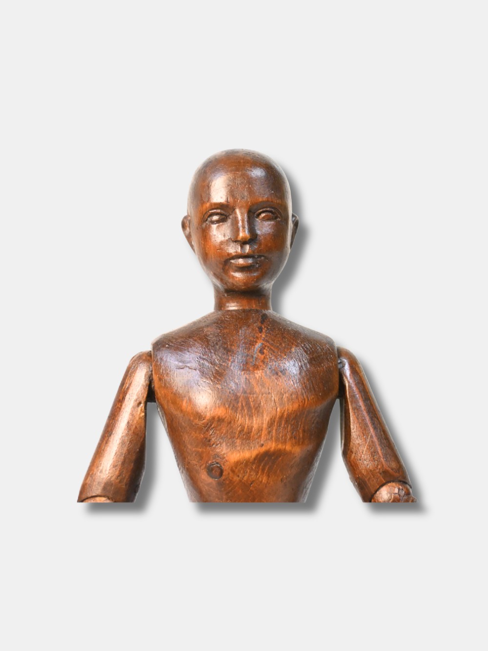 A French carved wood artist lay figure from circa 1890 with fully articulated limbs and a warm brown polished finish shown in a seated posture. View V