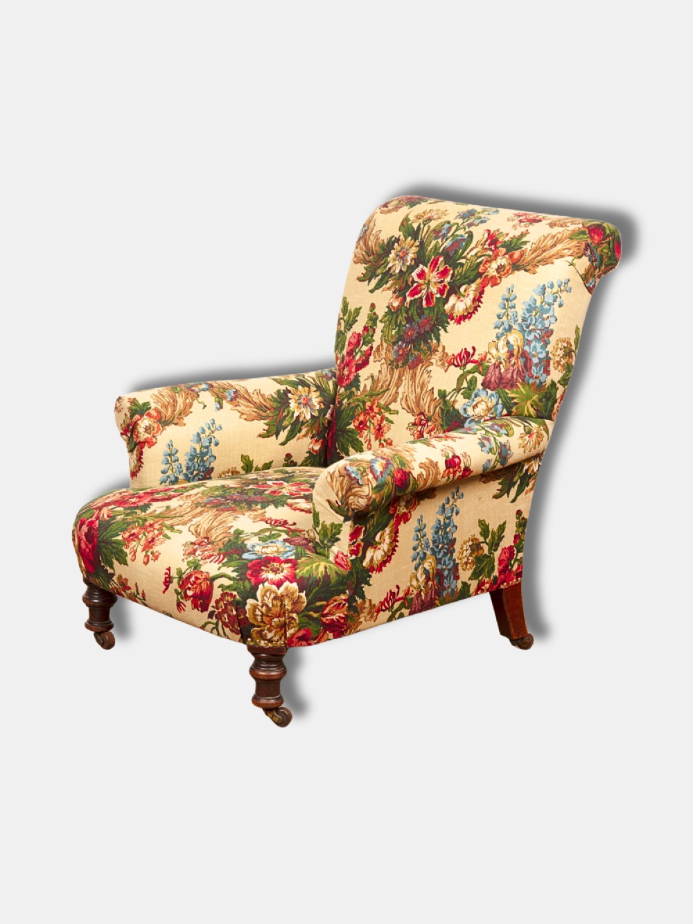 A Victorian mid-19th century armchair upholstered in cream floral fabric with turned dark timber front legs on brass castors. View III