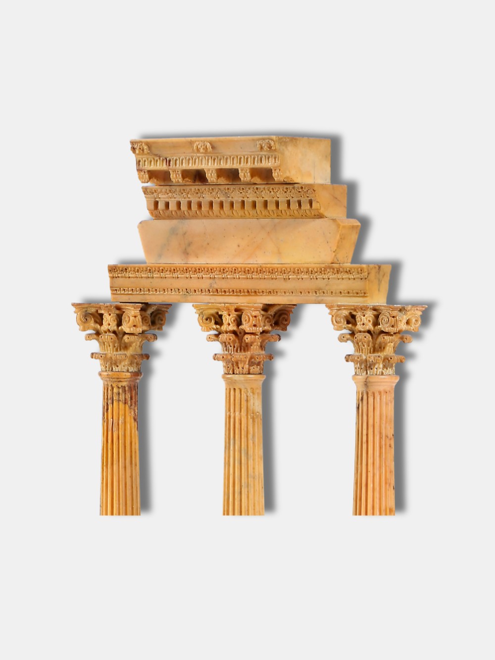A yellow Giallo Antico marble model depicting three fluted Corinthian columns and entablature from the Temple of Castor and Pollux set on a black marble base. View III