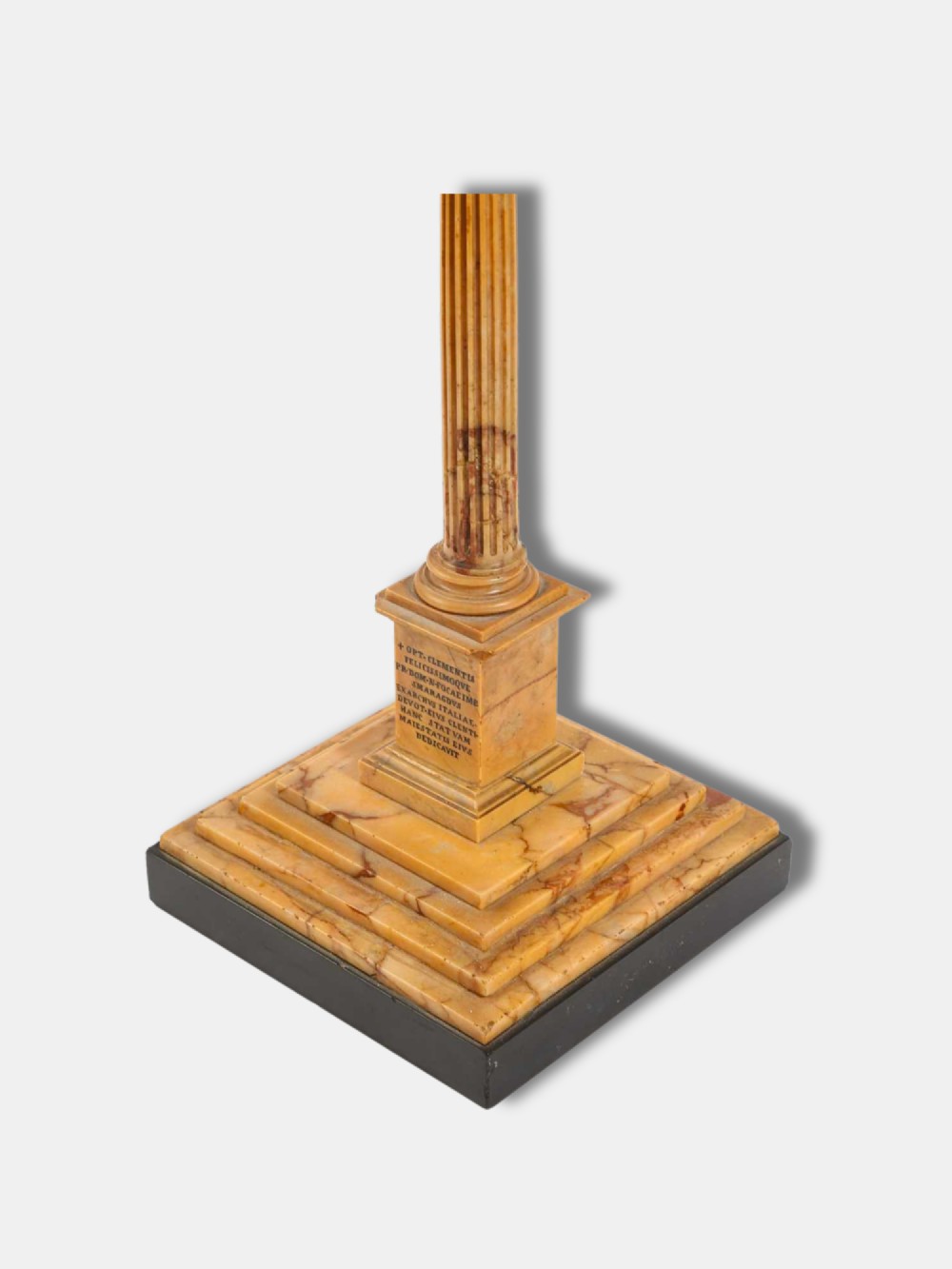 A detailed miniature architectural model of the Column of Phocas carved from yellow Giallo Antico marble with a small bronze figure atop, set upon a stepped square base. View III