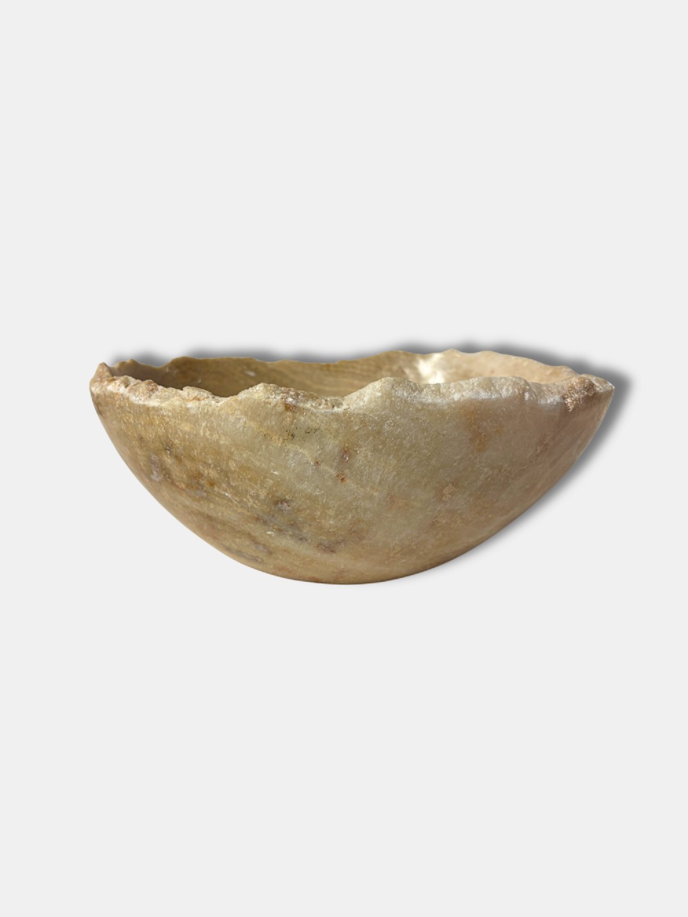 A shallow circular Italian onyx bowl featuring a polished interior surface and an unrefined natural live edge. View III