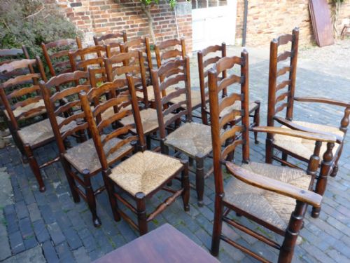 Harlequin Set of 14 Antique Ladder Back Dining Chairs