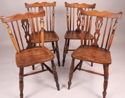 An Attractive Harlequin Set of Kitchen Chairs
