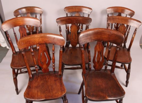 A Harlequin Set of 8 Victorian Kitchen Chairs